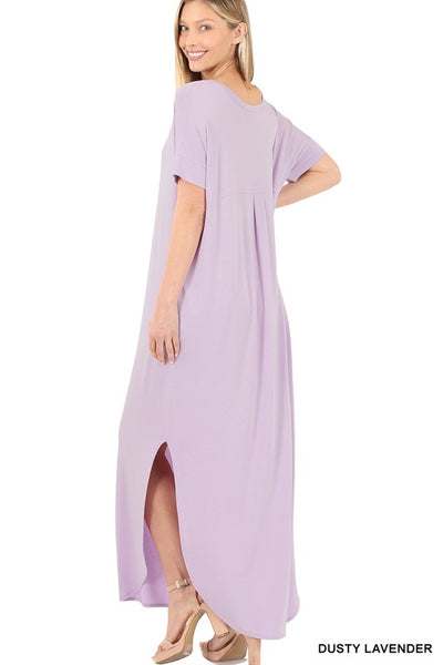 Tall woman with ponytail wearing Dusty Lavender colored Maxi dress with slit down side from knee to ankles