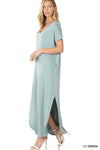Tall woman with ponytail wearing Light Green colored Maxi dress with slit down side from knee to ankles
