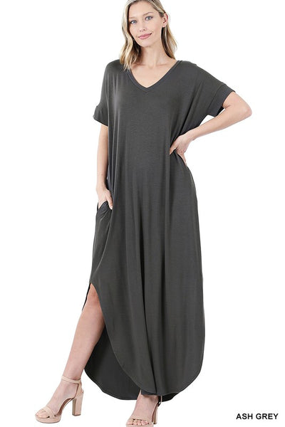 Tall woman with ponytail wearing Ash Gray colored Maxi dress with slit down side from knee to ankles