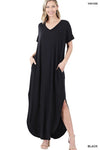 Tall woman with ponytail wearing a Black colored Maxi dress with slit down side from knee to ankles