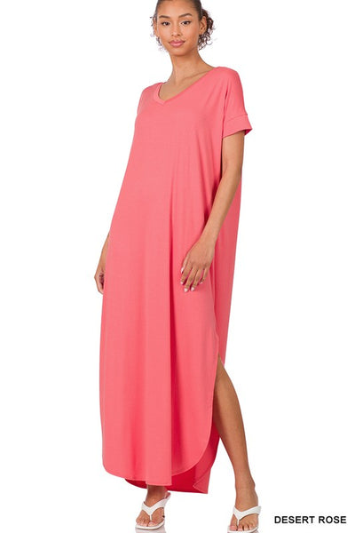 Tall woman with ponytail wearing Desert Rose Maxi dress with slit down side from knee to ankles