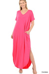 Tall woman with ponytail wearing Fuscia/Pink Maxi dress with slit down side from knee to ankles