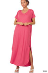 Tall woman with ponytail wearing Rose Maxi dress with slit down side from knee to ankles
