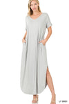 Tall woman with ponytail wearing Light Grey Maxi dress with slit down side from knee to ankles