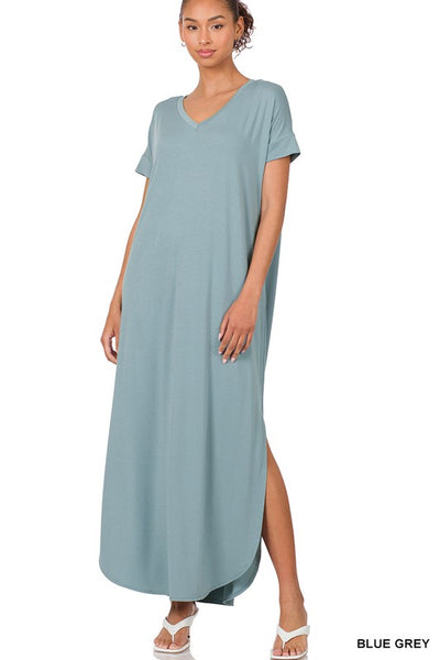 Tall woman with ponytail wearing Blue Gray Maxi dress with slit down side from knee to ankles