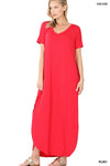Tall woman with ponytail wearing Ruby Maxi dress with slit down side from knee to ankles