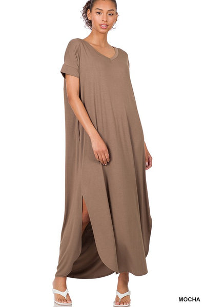 Tall woman with ponytail wearing Mocha Maxi dress with slit down side from knee to ankles