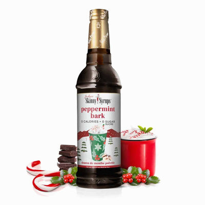 An image of a bottle of Peppermint Bark Syrup, featuring a festive label with a peppermint candy cane and chocolate bark illustration, capturing the essence of the holiday season